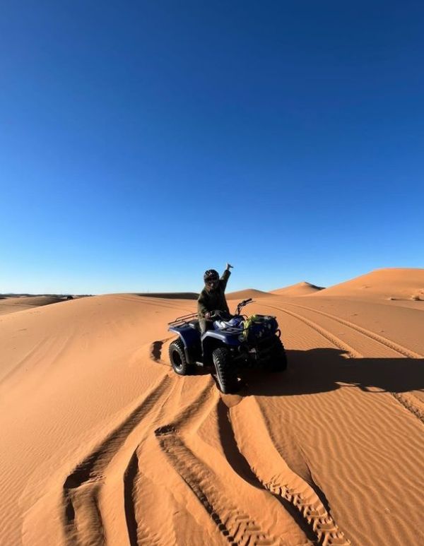 man riding a quad bike